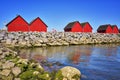 Breakwaters with red fisherman houses at the harbor Weisse Wiek in Boltenhagen at the Baltic Sea. Germany