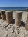 Breakwaters stump wooden. Shadows of people on the pier. Baltic Sea view from Svetlogorsk, Kaliningrad region Royalty Free Stock Photo