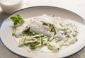 Bream fillet with zucchini and onion sauce Royalty Free Stock Photo