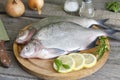 Bream raw fish on cutting board Royalty Free Stock Photo