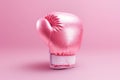 Breast cancer awareness concept with glittering pink boxing gloves for girl and woman fight with illness on pink background