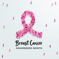 Breast cancer awareness month concept poster. Large group of people form to create a pink ribbon. Royalty Free Stock Photo