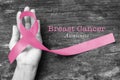 Breast cancer awareness pink ribbon on aged background, satin  bow symbolic concept raising help support on women people living Royalty Free Stock Photo