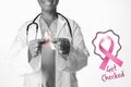Composite image of breast cancer awareness ribbons with get checked text Royalty Free Stock Photo