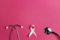 Breast cancer awareness symbol. Pink ribbon and stethoscope on p Royalty Free Stock Photo