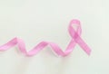 Breast cancer concept, pink ribbon on background