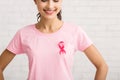 Unrecognizable Girl With Cancer Ribbon On T-Shirt Standing, White Background Royalty Free Stock Photo