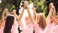 Breast Cancer Volunteers Ladies Holding Hands Standing In Circle Outside