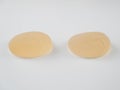 Breast implants on a white background. Plastic surgery. Royalty Free Stock Photo