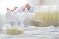 Breast milk frozen in storage bag and baby lying