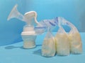 Breast milk in storage bags and breast pump Royalty Free Stock Photo