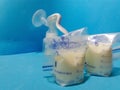 Breast milk in storage bags and breast pump Royalty Free Stock Photo