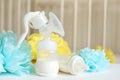 Breast pump and baby bottles with milk, various festive paper decor in front of baby bedroom. It`s a boy or baby birthday celebra Royalty Free Stock Photo