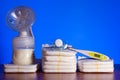 Breast pump and nappies and thermometer with a pacifier on a blue background