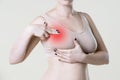 Breast test, woman examining her breasts for cancer, heart attack, pain in human body