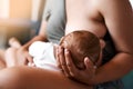 Breastfeeding and bonding go hand in hand. High angle shot of a young mother breastfeeding her newborn baby at home. Royalty Free Stock Photo
