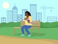 Breastfeeding in public. African american woman feeds baby in park