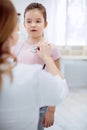 Female doctor assessing nice girls health Royalty Free Stock Photo