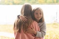 Breath portraits of little girls outside in summer, standing together