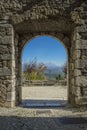 Breath-taking view of the mountains framed by the historic gate of the ancient village of Collalto Sabino