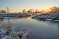 Breath of winter, first ice on the lake, dawn on a frosty morning with frost on the grass, close-up of frost, patterns on the Royalty Free Stock Photo