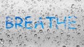 Breathe freedom free abstract background water droplets window glass raining rain dew writing word language sign sky clouds