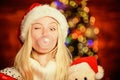 Breathe gently. Blow Bubbles with Gum. Only fun on my mind. Girl Santa claus making big bubble with gum. Funny face Royalty Free Stock Photo