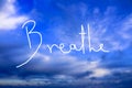 Breathe Handwritten logo in the sky Royalty Free Stock Photo