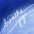 Breathe yoga in white letters on blue background, inspirational or motivational handwritten message about exercise and relaxation