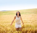 Breathing, freedom or happy woman in a field in the countryside in spring to relax on break. Smile, wellness or female Royalty Free Stock Photo