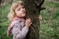 Breathing with nature. Girl takes deep breath of fresh forest air. Enjoying a moment of peace and relaxation in natural