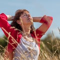 Breathing young senior woman in harmony with nature Royalty Free Stock Photo