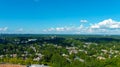 A breathtaking aerial shot of the cityscape of Brookhaven with buildings and vast miles of lush green with blue sky Royalty Free Stock Photo