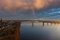 A breathtaking aerial shot of the running waters of the Mississippi river with powerful clouds and a stunning sunset