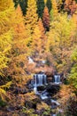 Breathtaking beautiful autumn landscape with waterfall in the Dolomites, South Tyrol, Alps, Italy. Meditation, rest, calm, anti-