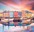 Breathtaking beautiful scenery with boats in the famous Nyhavn in Copenhagen, Denmark at sunrise. Exotic amazing places. Popular Royalty Free Stock Photo