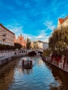 Breathtaking cityscape view of the Slovenian capital Ljubljana over Ljubljanica river under blue sky