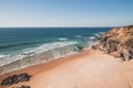 Breathtaking cliffs surround the sandy beach of Praia da Angra da Cerva on the Atlantic coast near Vila Nova de Milfontes, Odemira Royalty Free Stock Photo