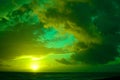 Breathtaking cloudy sunset sky scenery with vibrant green colors - perfect for a wallpaper Royalty Free Stock Photo