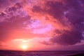Breathtaking cloudy sunset sky scenery with vibrant pink colors - perfect for a wallpaper Royalty Free Stock Photo