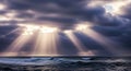 Dramatic Sun Rays Piercing Through Storm Clouds Over Ocean Royalty Free Stock Photo