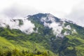 Breathtaking Green Landscape with Foggy Mountains and Waterfalls during Monsoon in Nepal Royalty Free Stock Photo