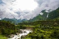 Breathtaking Green Landscape with Foggy Mountains and Waterfalls during Monsoon in Nepal Royalty Free Stock Photo