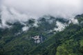 Breathtaking Green Landscape with Foggy Mountains and Waterfalls during Monsoon in Nepal Royalty Free Stock Photo