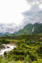 Breathtaking Green Landscape with Foggy Mountains and Waterfalls during Monsoon in Nepal Royalty Free Stock Photo