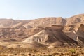 Rocky and dusty mountains in the Judaean Desert Midbar Yehuda Nature Reserve. Small Crater to Highway #90 and Golani Trail.