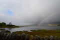 Breathtaking landscape in Scotland with a rainbow in the background