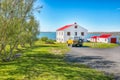 Breathtaking landscape of sunny day at Lake Myvatn with green meadow and nice house near Reykjahlid town Royalty Free Stock Photo