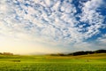 Breathtaking lansdcape of Austrian countryside on sunset. Dramatic sky over idyllic green fields of Anstrian Central Alps on autum Royalty Free Stock Photo