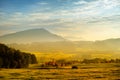 Breathtaking lansdcape of Austrian countryside on sunset. Dramatic sky over idyllic green fields of Anstrian Central Alps on autum Royalty Free Stock Photo